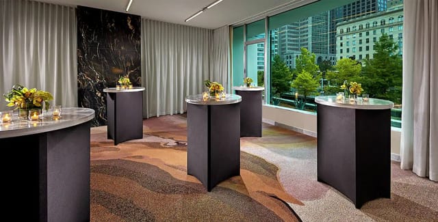 Modern meeting room at The Statler with natural light for professional events.