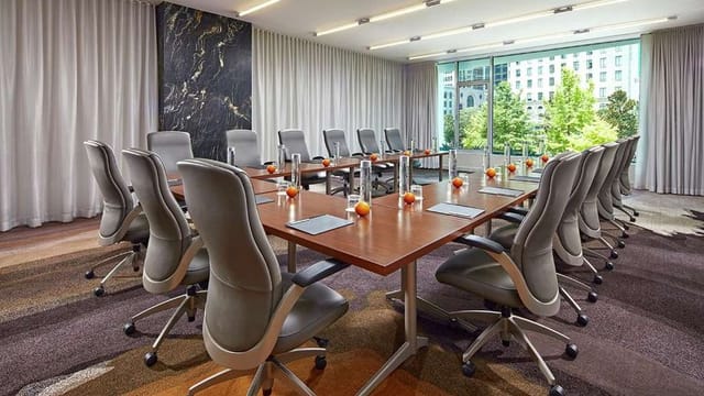 Modern conference room at The Statler with ergonomic chairs for productive meetings.
