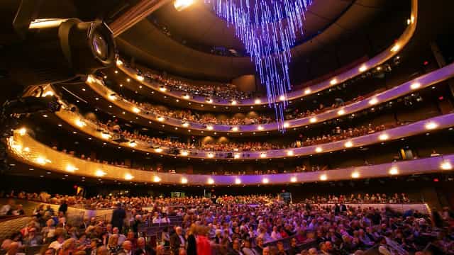 "Winspear Opera House auditorium with stunning chandelier for events and performances"