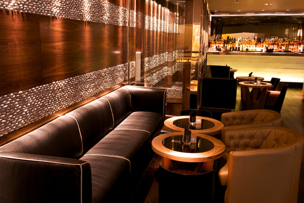 Sophisticated lounge with plush seating, ideal for networking events and meetings. - Banner