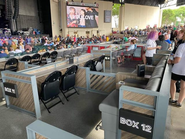 Vibrant private boxes setup for an outdoor concert at Dos Equis Pavilion.