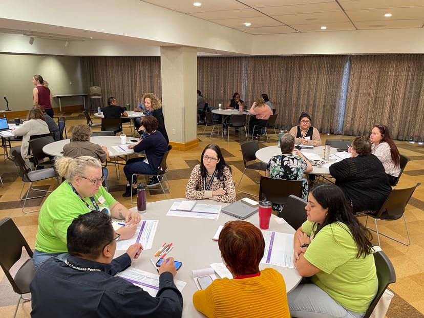 Meeting Rooms in Dallas Public Library with round tables for collaborative workshops and networking.