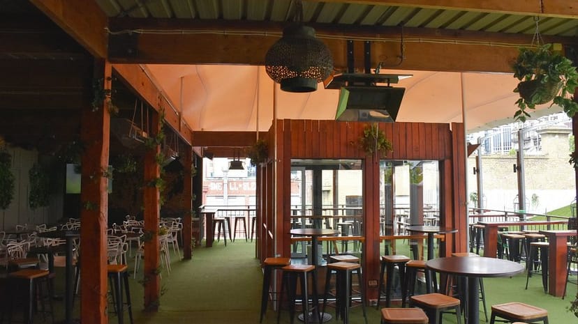Rooftop Cocktail Bar at The Emerald Peacock with greenery, perfect for casual gatherings and events.