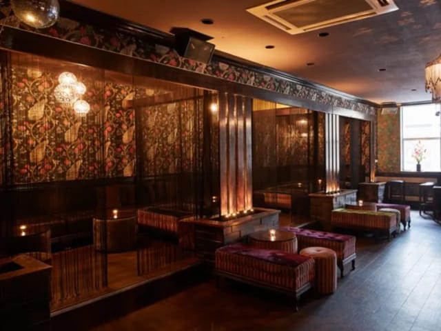 Stylish venue with floral wallpaper for upscale events and intimate gatherings.