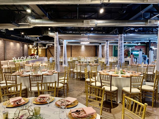 Elegant 1st Floor Commerce Room with gold chairs for weddings and corporate events.
