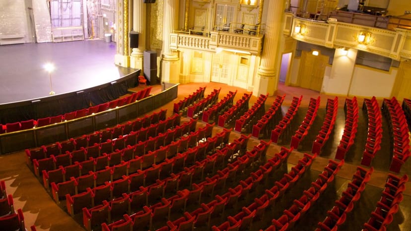 Majestic Theatre red seats stage ideal for events, performances, and conferences.