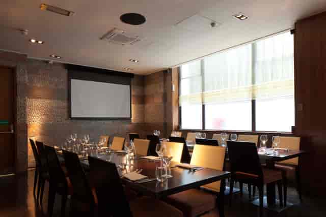 Private dining room with elegant table setup for corporate events and meetings.