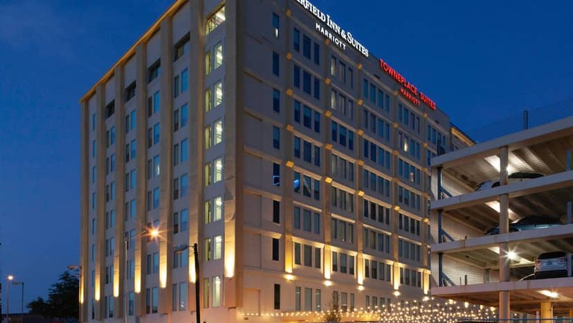 Modern hotel exterior at dusk, ideal for conferences in Dallas Downtown.