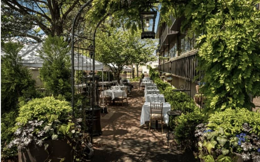 Elegant outdoor dining area in La Pergola, perfect for weddings and corporate events.