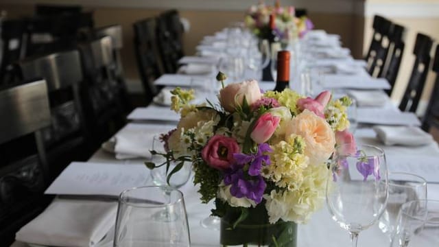 Elegant dining table at La Pergola for corporate events and private gatherings.