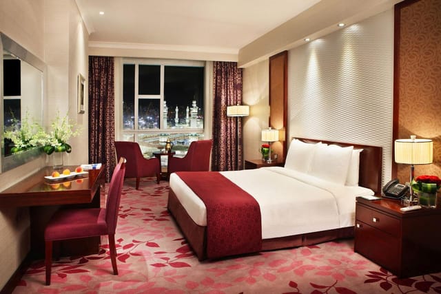 "Stylish hotel room in Al Marwa Rayhaan for meetings and events with city view."