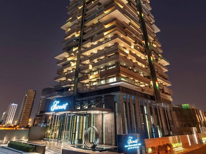 Noura Boardroom at Fairmont Ramla, upscale venue for events and meetings, illuminated at night.