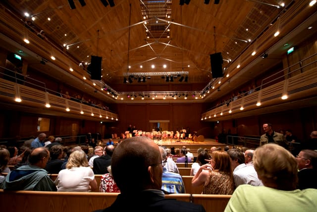 Auditorium in The Apex with tiered seating, ideal for conferences and performances.