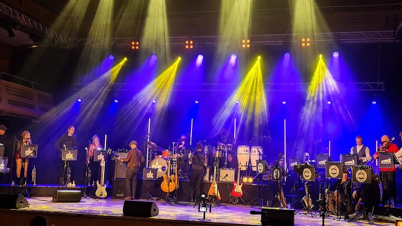 Live band on stage at Studio 2a, vibrant lighting for corporate events and celebrations.