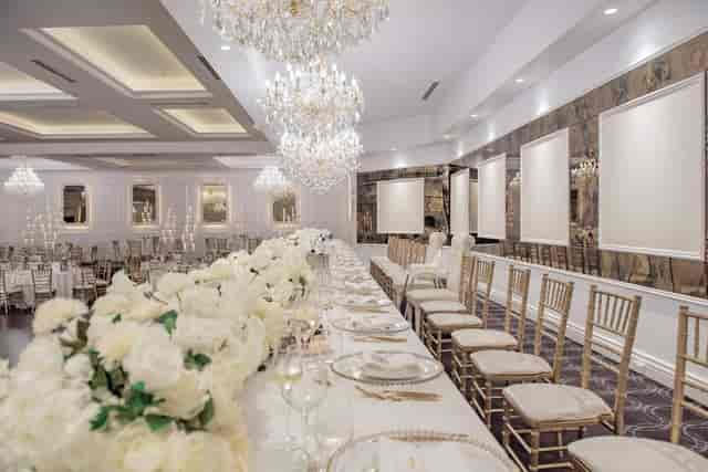 Elegant Delphinium Room banquet hall with white flowers, perfect for weddings and galas.