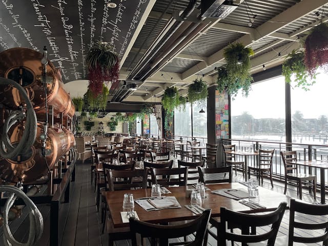 Brasserie room at The Cove Hotel with copper tanks, perfect for social events and meetings.