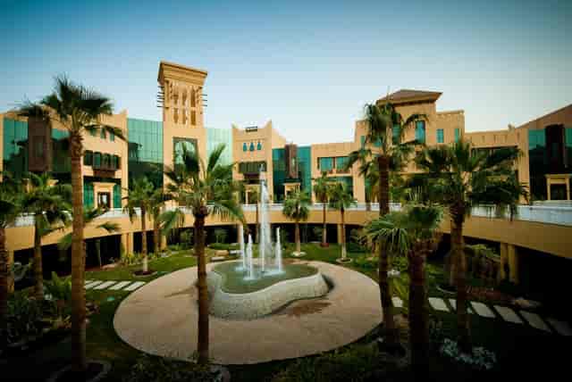 Elegant suites at Al Mashreq Boutique Hotel with lush gardens for receptions and networking.