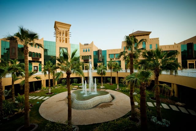 Elegant suites at Al Mashreq Boutique Hotel with lush gardens for receptions and networking.