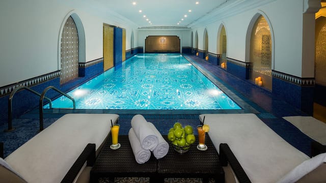 Al Orouba Meeting Room with elegant indoor pool, perfect for wellness retreats.