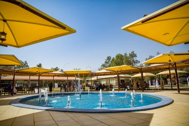 Riyadh Golf Club outdoor event space with pool, ideal for networking and gatherings.