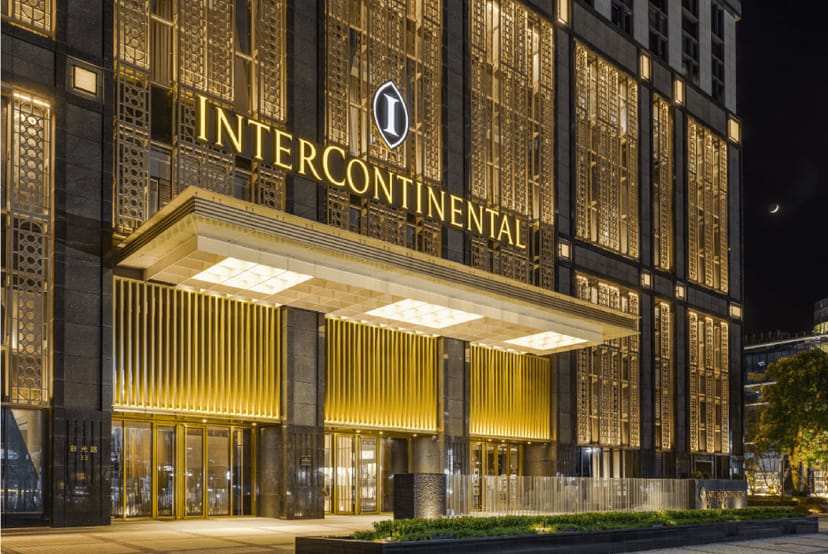 Elegant InterContinental hotel facade at night, ideal for upscale events and meetings.