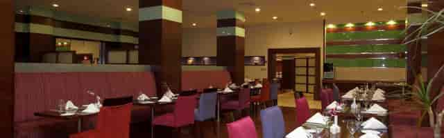 Vibrant restaurant at Holiday Inn Al Qasr Riyadh, ideal for meetings and events.
