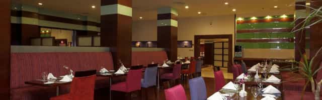 Vibrant restaurant at Holiday Inn Al Qasr Riyadh, ideal for meetings and events.