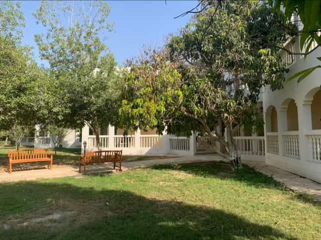 "Villas at Al Nahda Resort: serene outdoor space for events, networking, and relaxation."