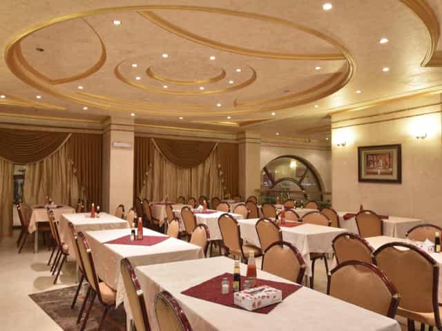 Sophisticated dining area at Al Mukhtara Hotel, ideal for corporate events and gatherings.