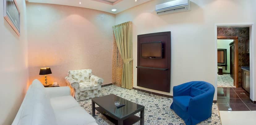 "Meeting space at Al Farhan Suites Ishbillia with soft seating for professional events"