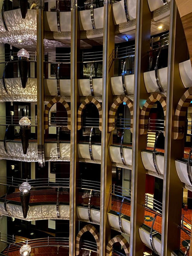Elegant hotel atrium with arches, perfect for networking events at LEADER Al Muna Kareem.