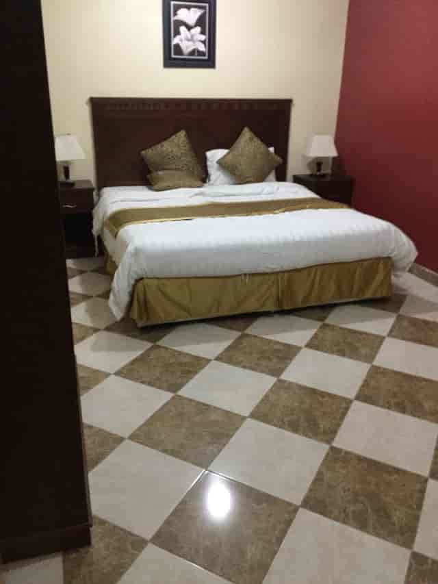 Luxury hotel room with elegant bedspread, ideal for events and conferences.
