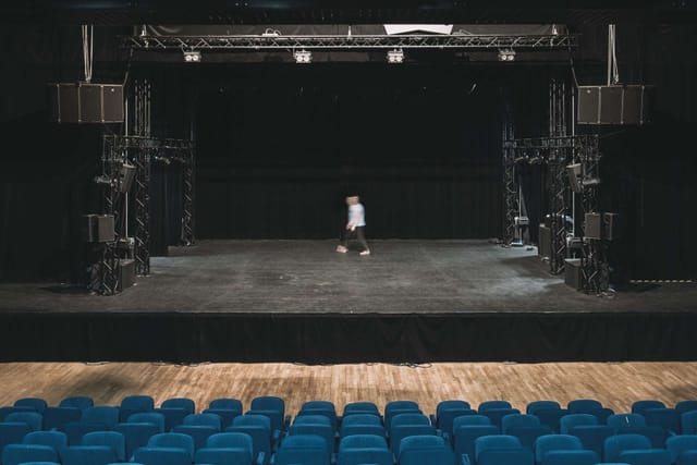 Concert hall stage setup in L'Épicerie Moderne for upcoming performances and events.