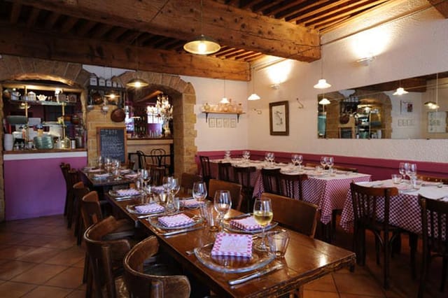 Charming restaurant interior with rustic beams, perfect for intimate events or meetings.