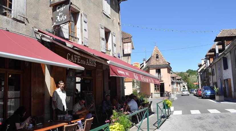 Charming Le Café des Arts outdoor seating for informal meetings and networking events.