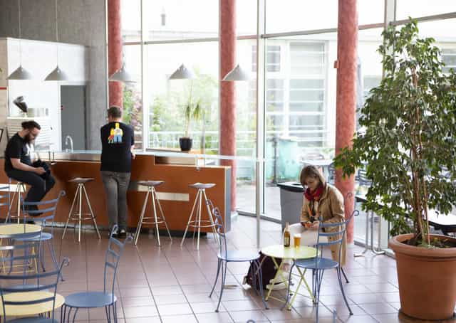 Modern cafe in CISL Lyon, bright space for networking and meetings.