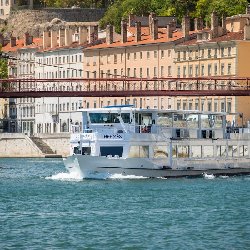 Modern riverboat restaurant Bateau Hermès II, ideal for events on scenic waterways.