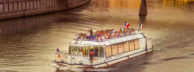 Stylish event boat Saint-Exupéry on calm waters for corporate functions and gatherings.