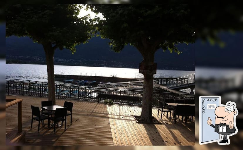 Scenic outdoor restaurant at La Maison des Pêcheurs, ideal for events and meetings.