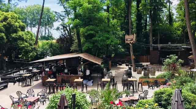 Open-air restaurant venue in Les Jardins de l'Olympe, ideal for outdoor events and gatherings.