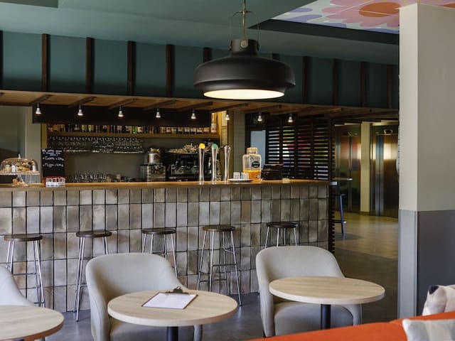 Contemporary café in Salle Lionel Terray, ideal for meetings and networking events.