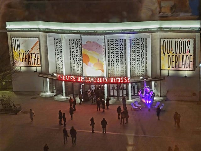 Vibrant theater entrance at Théâtre de la Croix-Rousse for engaging performances and events.