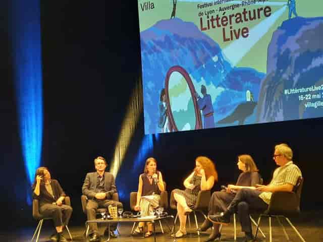 Panel discussion at Théâtre de la Croix-Rousse during a literature festival.