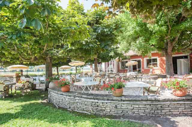 Outdoor restaurant venue at Le Beau Rivage, perfect for events and social gatherings.