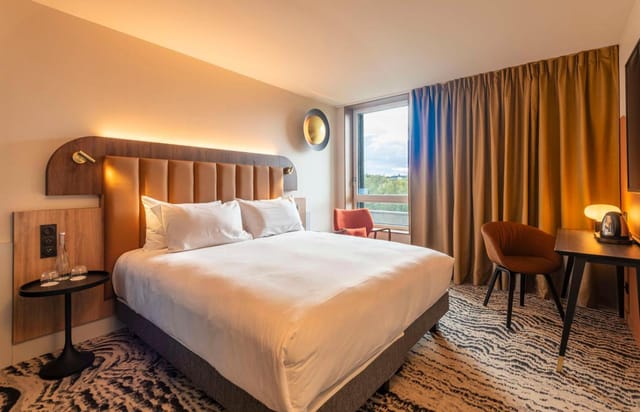 Modern hotel suite at DoubleTree Lyon Eurexpo, ideal for meetings and retreats.