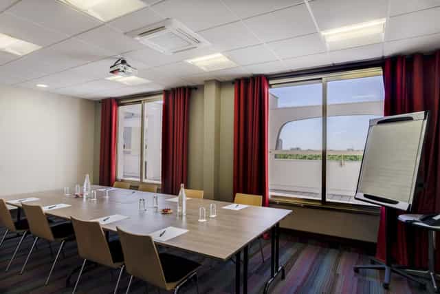 Main Conference Hall at Hôtel des Congrès: modern venue for professional meetings and presentations.