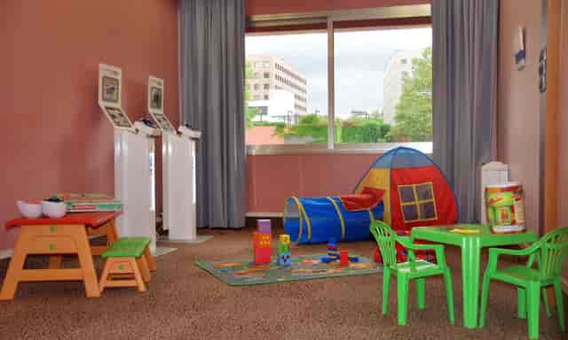Children's play area in Hôtel des Congrès for family-friendly events and gatherings.