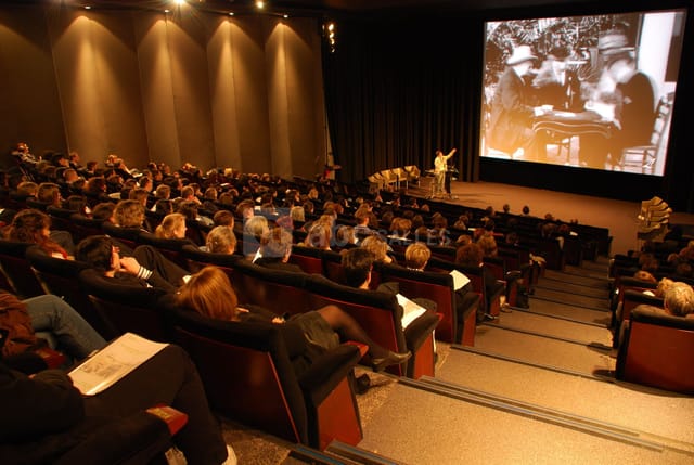 Movie theater at Institut Lumière with elevated seating for presentations and screenings.