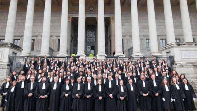 Yves BERGER with legal professionals at a formal event outside a grand building.