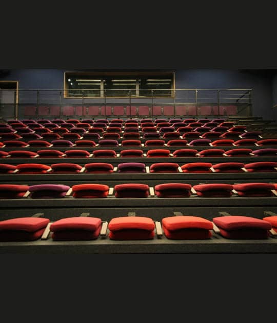 Tiered seating in La Salle 200 at CENTQUATRE-PARIS, ideal for presentations and performances.